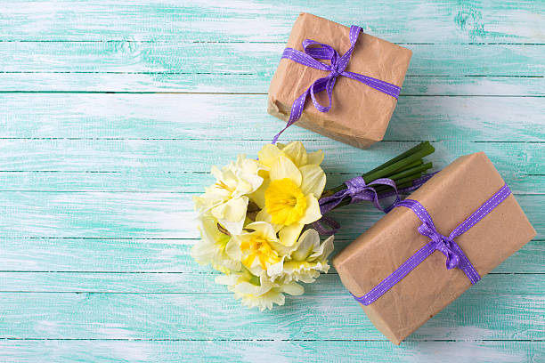 istock Bunch of fresh  spring  flowers and gift boxes 486569340