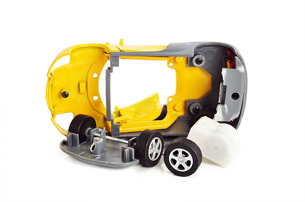 Broken Toy Car A broken toy on white background broken toy stock pictures, royalty-free photos & images