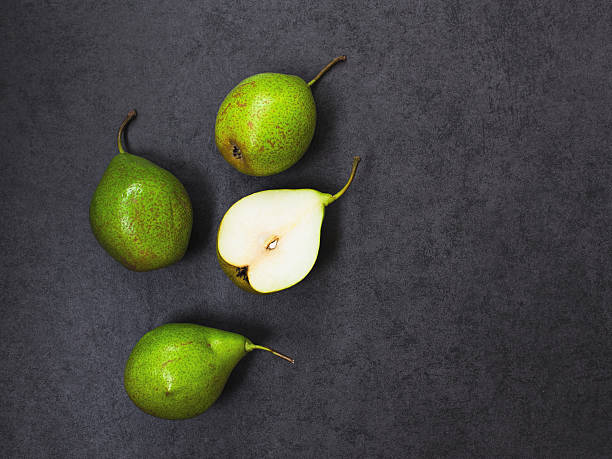 Four  pears on gray background
