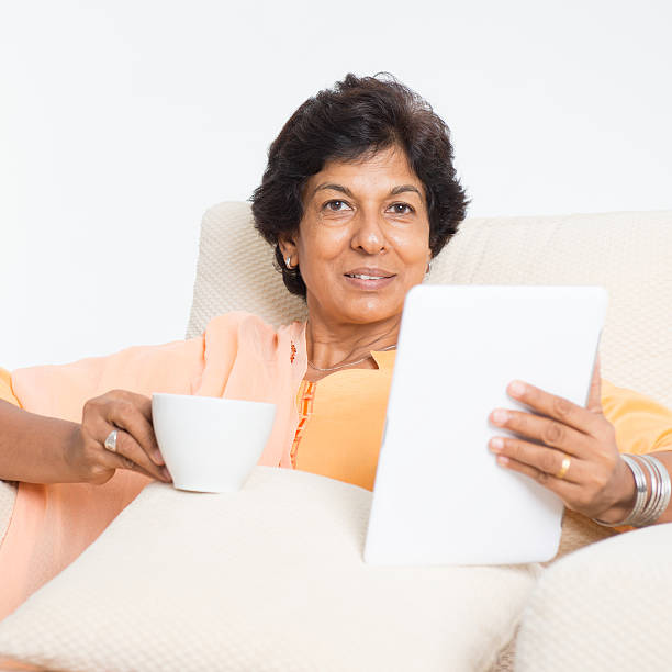 istock Indian mature woman using social media 486572278