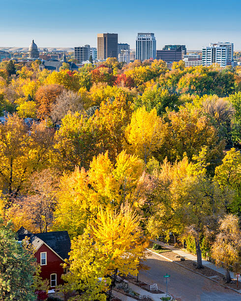 istock Residentual home in the fall with the City 486572569