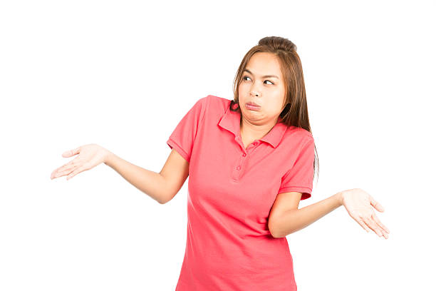 istock Not Sure Asian Woman Shoulders Shrugging Hands Up 486573436