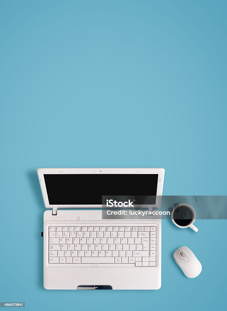 White laptop on table - place for text. Backgrounds Stock Photo