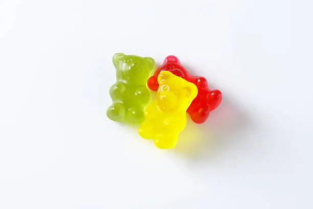 three gummy bears isolated on white background