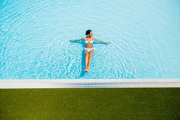istock Young woman in the pool 486574098