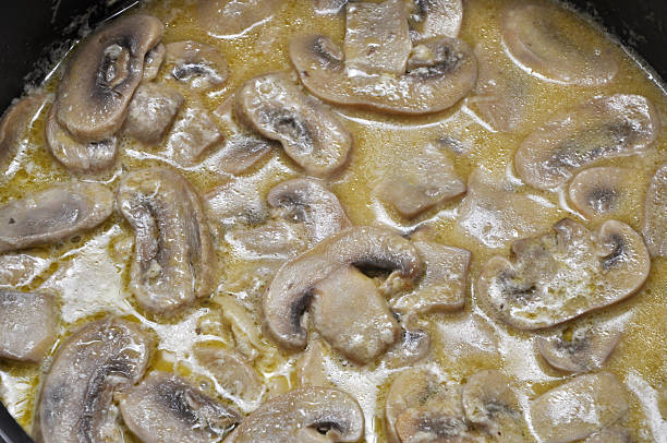 istock Hot sliced mushrooms in cream sauce 486575104