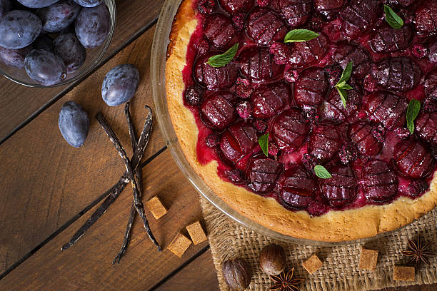 istock Delicious cake with fresh plums and raspberries 486575286