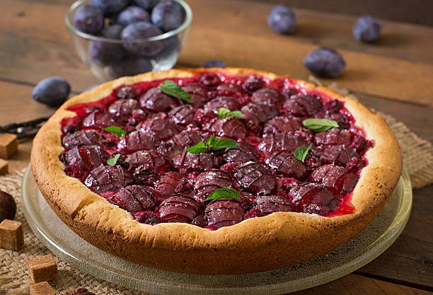 istock Delicious cake with fresh plums and raspberries 486576844