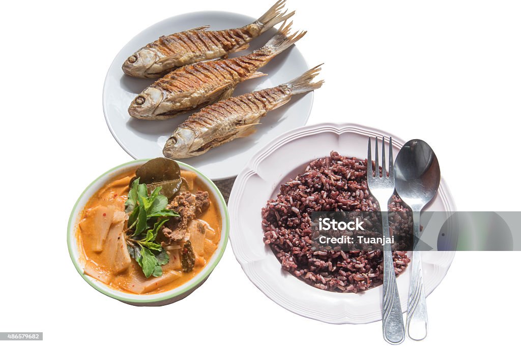 Fried fish, Red Curry beef with Bamboo Shoots and Riceberry Fried fish, Red Curry beef with Bamboo Shoots and Riceberry,Thai style food 2015 Stock Photo