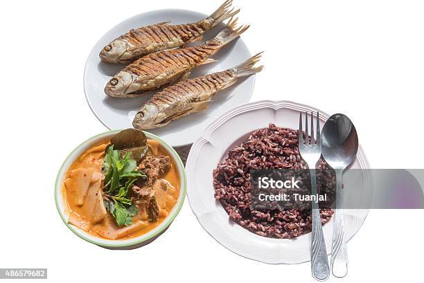 Fried Fish Red Curry Beef With Bamboo Shoots And Riceberry Stock Photo - Download Image Now
