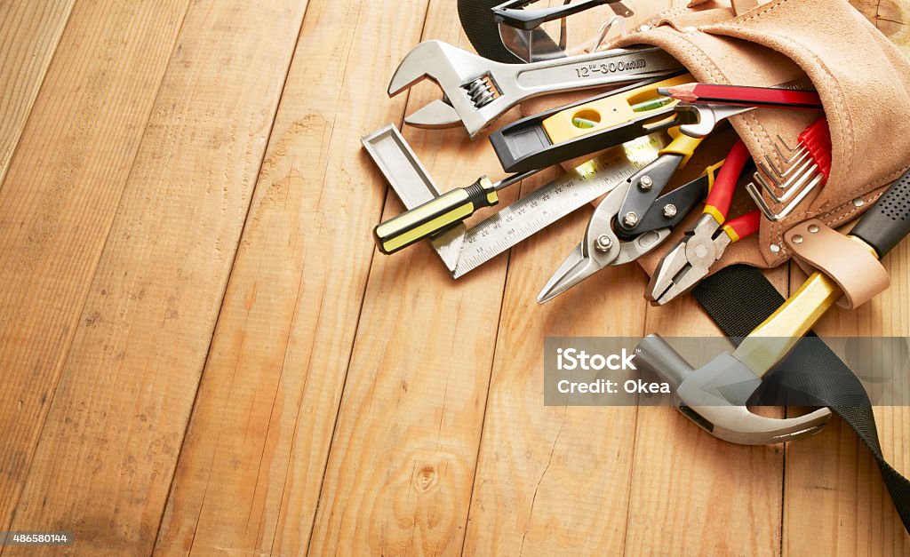 tool belt with tools tool belt with tools on wood planks with copy space Work Tool Stock Photo