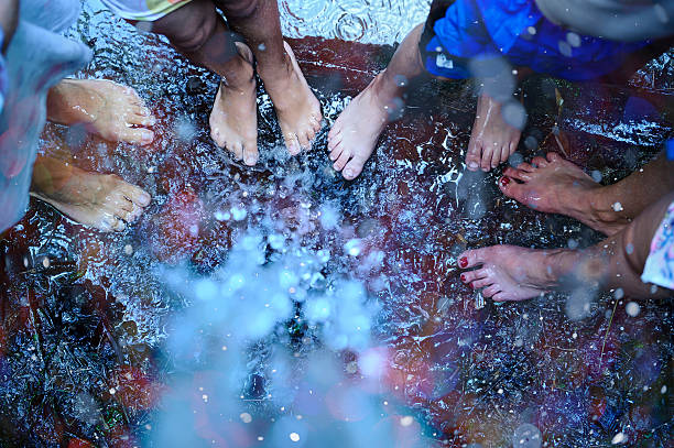 family, feet i the waterfall,  view from  top.