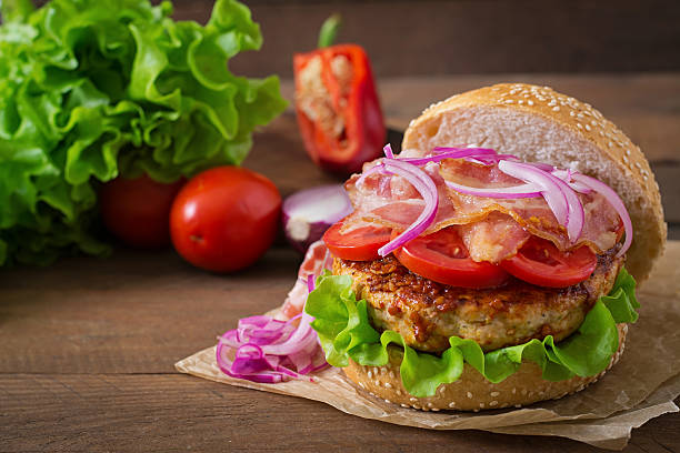 istock Big sandwich - hamburger burger with beef, red onion, tomato. 486584762