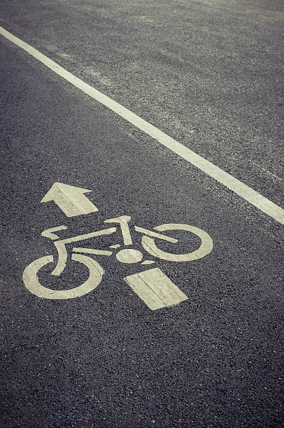 istock bicycle lane sign on the road 486585718