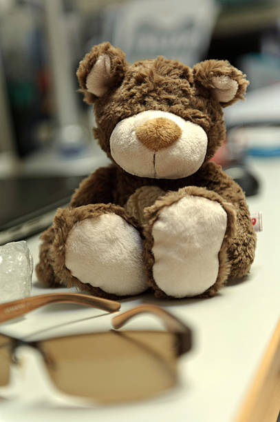 istock Toy teddy bear sitting on the table 486585944