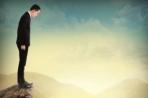 istock Young business man looking down the cliff 486587346