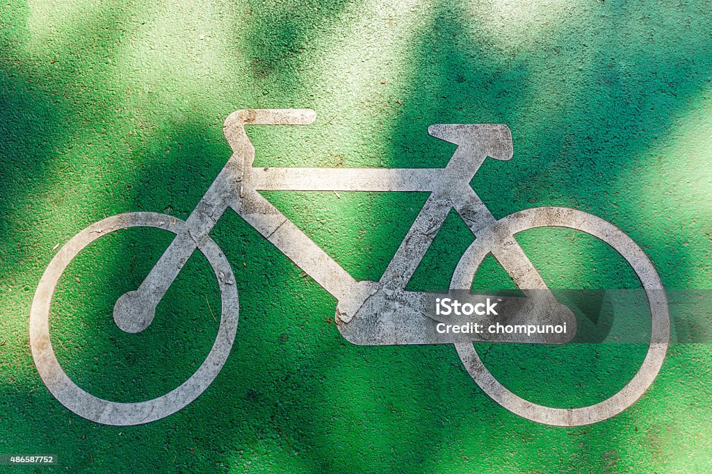 bicycle the white bicycle. this is a symnol of bike lane on the street. 2015 Stock Photo bicycle the white bicycle. this is a symnol of bike lane on the street. 2015 Stock Photo