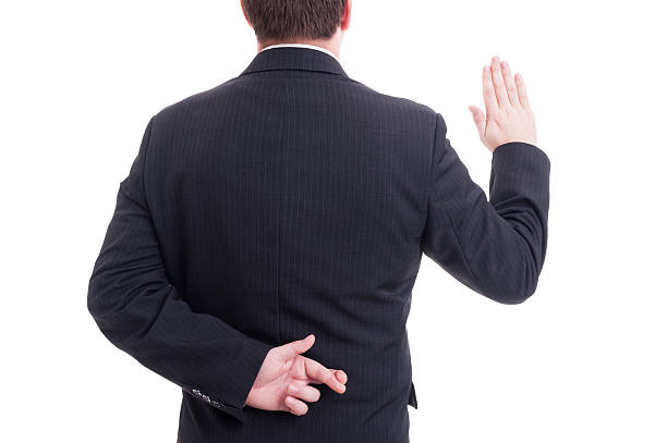 istock Business man swearing false with crossed fingers behing back 486587896