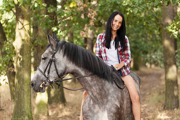 istock Young woman with a horse 486588888