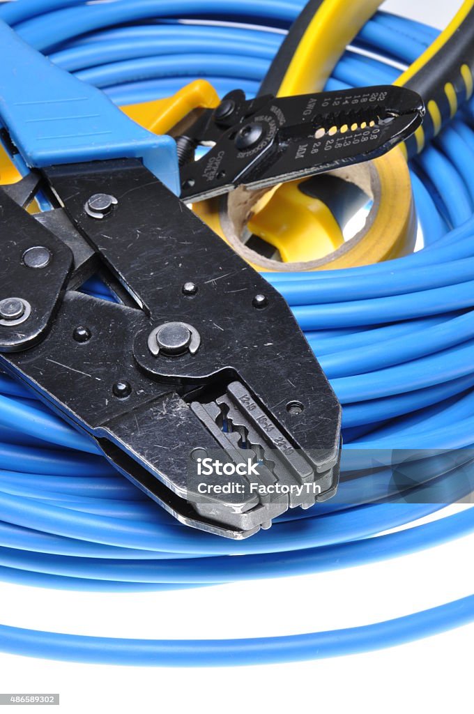 Crimping tool and cables Crimping tool and cables isolated on white background 2015 Stock Photo