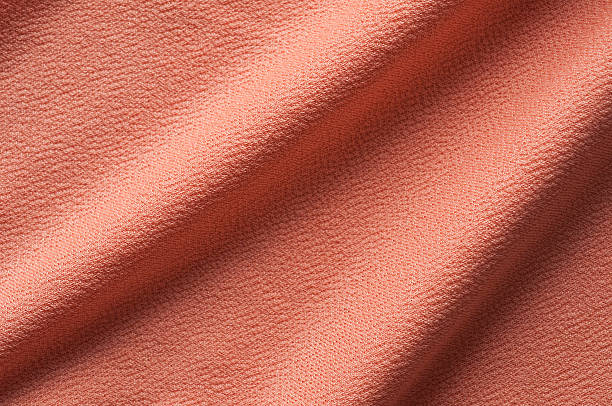 istock Sweet orange clothes fabric 486590378