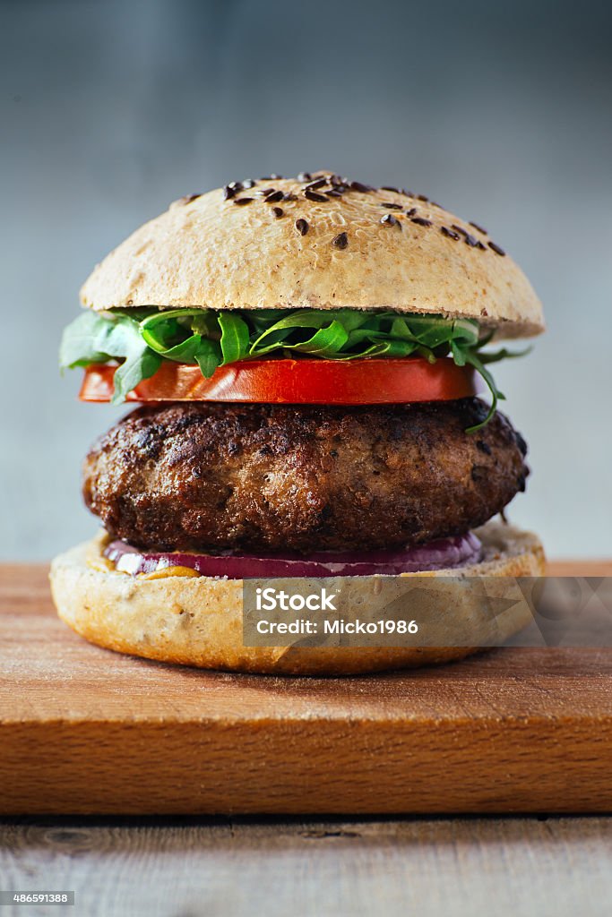 Delicious burgers with beef, tomato, cheese and lettuce Burger Stock Photo