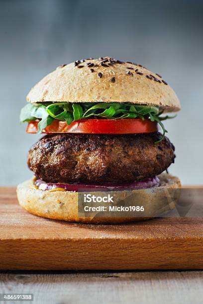 Delicious Burgers With Beef Tomato Cheese And Lettuce Stock Photo - Download Image Now