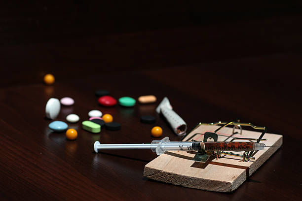 istock Drugs in a mousetrap cant dose syringe 486591702