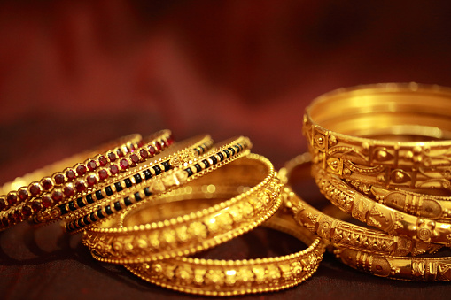 Beautifully crafted traditional Indian gold jewellery for women. The ornaments are known as bangles worn to hands and made up of 22 carat gold.