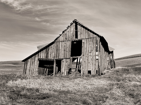 An old run down barn in a field near Potlach, Idaho.