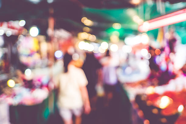 istock Blurred background : people shopping at market fair 486597392