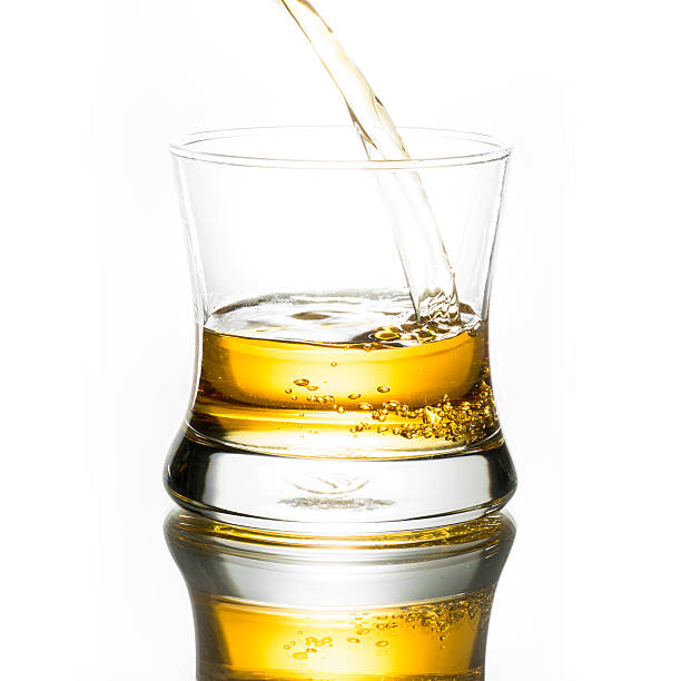 istock Pouring whiskey into the glass 486597700