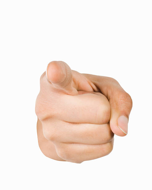 Close-up of a person's hand pointing forward stock photo