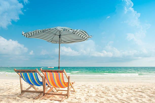 istock Two Chairs and Umbrella at the beach 486598935