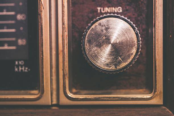 Vintage Tuning Dial in Aged Radio Device. Closeup Photo.