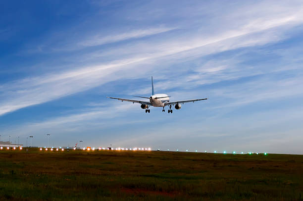 istock passenger plane fly up over take-off runway from airport 486601248