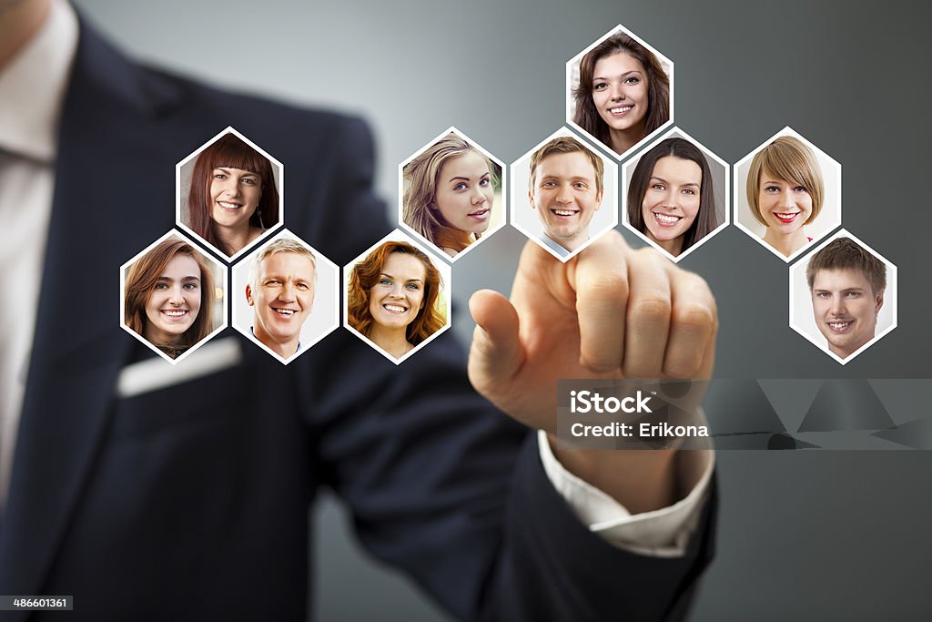 Social networking people Businessman touching button with social networking people Adult Stock Photo