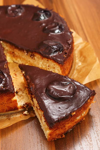 istock Chocolate Topped Sponge Cake with Prunes and Toffee Sauce 486601775