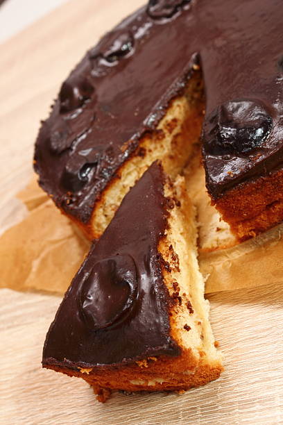 istock Chocolate Topped Sponge Cake with Prunes and Toffee Sauce 486601785