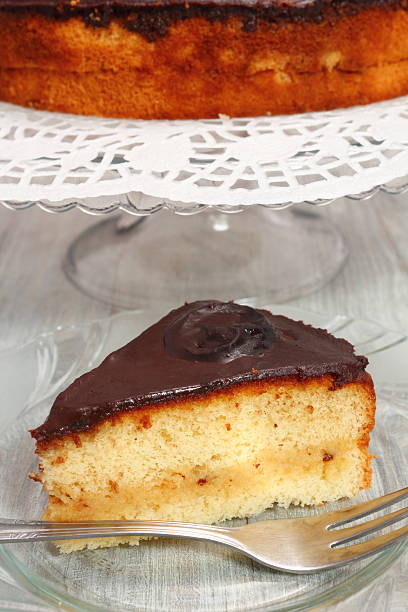 istock Chocolate Topped Sponge Cake with Prunes and Toffee Sauce 486601795