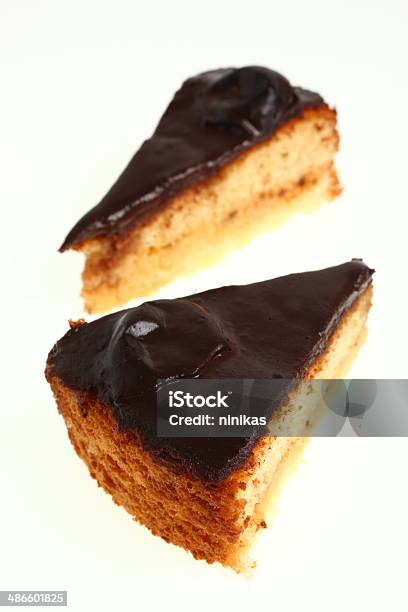 Chocolate Topped Sponge Cake With Prunes And Toffee Sauce Stock Photo - Download Image Now