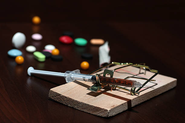 istock Drugs in a mousetrap cant dose syringe 486601960