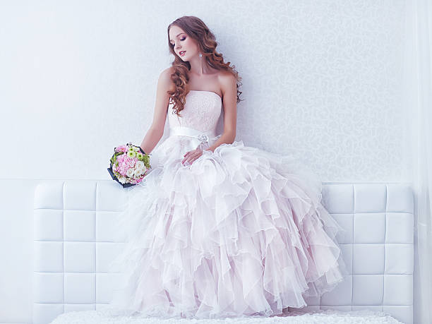 istock beautiful bride with wedding bouquet 486601979