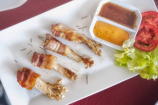 istock Golden mushroom wrapped in Bacon Pan-Fried 486602799