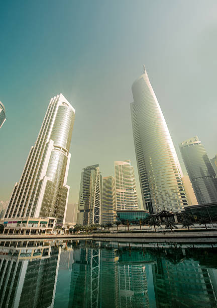 Skyscraper apartments and office development Cityscape of High Rise lifestyle apartments and offices with clear skies. jumeirah stock pictures, royalty-free photos & images
