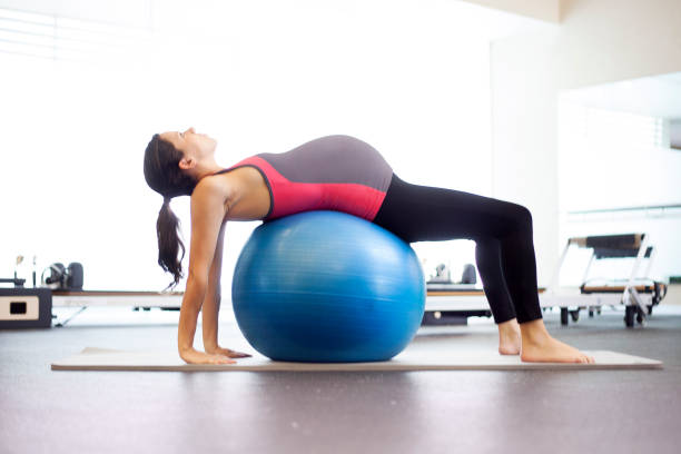 istock Pregnant woman with exercise ball 486604261