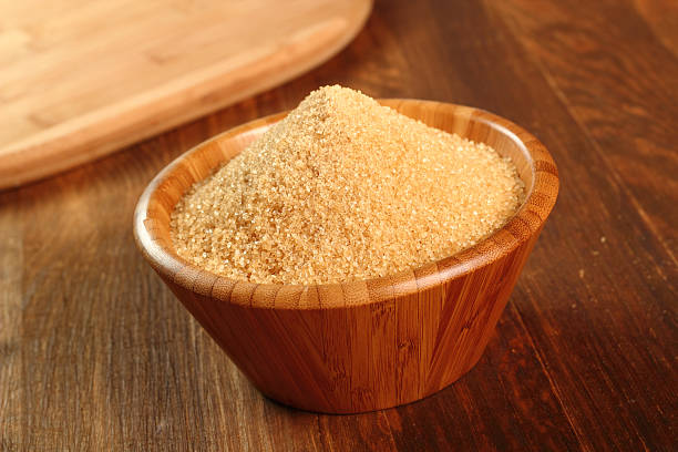 istock Cane Sugar in wooden bowl 486604273