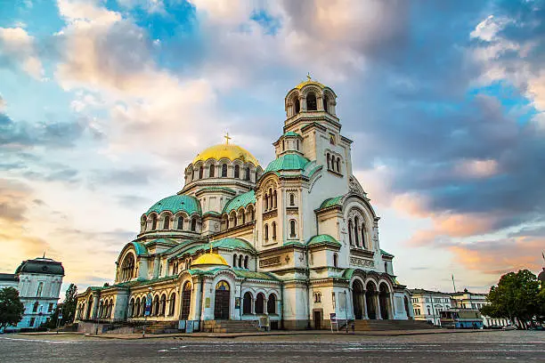 St. Alexander Nevsky Cathedral in the center of Sofia, capital of Bulgaria against the blue morning sky with colorful clouds