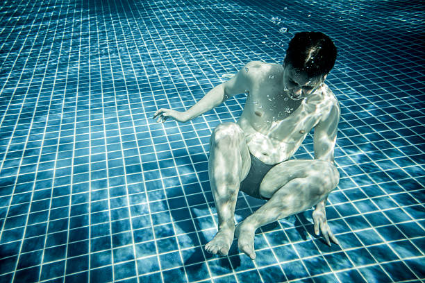 istock Man under water in a swimming pool 486608072