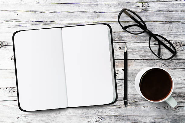 istock White blank notebook, cup of coffee and glasses, mock up 486608434